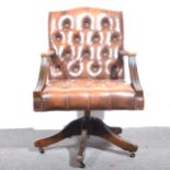 A leather office elbow chair.