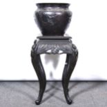 Japanese bronze jardinière on carved wooden stand, late 19th century.