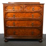 An oak chest of drawers.