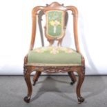 Victorian carved walnut nursing chair, wool work upholstery