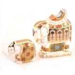 Two Royal Crown Derby Imari elephant paperweights.