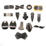 Ten Art Deco black glass dress clips/brooch and five similar belt buckles.