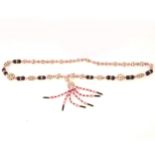 1920's sautoir necklace of clear paste, pink and black glass beads.