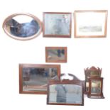 Various wood-framed mirrors and a print.