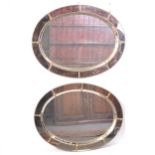 Pair of gilt metal oval mirrors