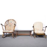 Ercol dark stained rocking chair, and a matching easychair, with coffee table/