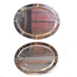 Pair of gilt metal oval mirrors, late 20th century.