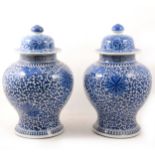 A pair of Chinese blue and white covered vases