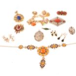 Vintage costume jewellery in the antique style, brooches, bracelet with seals, earrings.