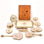 Victorian specimen marquetry blotter, and a gilt metal dressing table set.