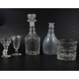 A pair of Regency style mallet-shape decanters, plus other decanters and wine glasses.