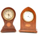 Two mantel clocks.