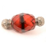 A Victorian small double-ended red glass scent bottle.