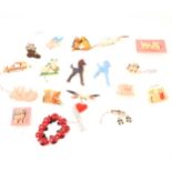 Eighteen novelty celluloid, plastics children's themed costume jewellery, 1930's-1950's