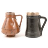 Doulton Lambeth silicon stoneware 'riveted copper' jug, and another 'Black Jack' jug.