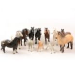 A collection of Beswick horse models.