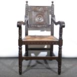 Victorian carved oak elbow chair.