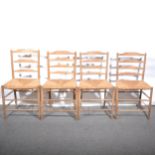 Four similar Arts and Crafts ash ladder-back chairs, in the manner of Ernest Gimson
