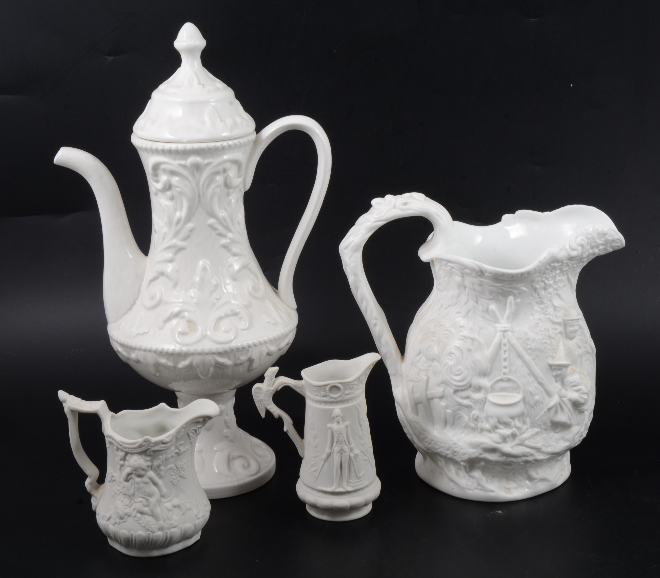 A Samuel Alcock & Co white stoneware jug, plus other white pottery items.