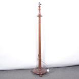 Mahogany standard lamp, fluted shaft, circular base.