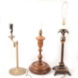 An Indian carved teak lamp base, and five other table lamps.