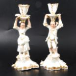 Pair of porcelain figural candlesticks.