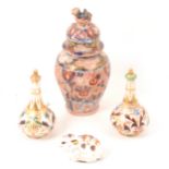 Pair of Derby scent bottles, Imari vase and Royal Crown Derby paperweight.