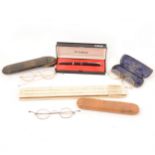 Antique spectacles, Parker pen, slide rule and a wooden box.