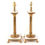Pair of brass and marble Corinthian table lamps.