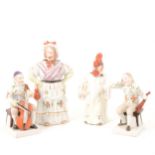 Pair of German porcelain musicians, and two nodding head figures.