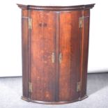 George III oak bowfront hanging corner cupboard