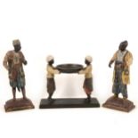 Pair of patinated North African street vendors, and a similar figural dish.