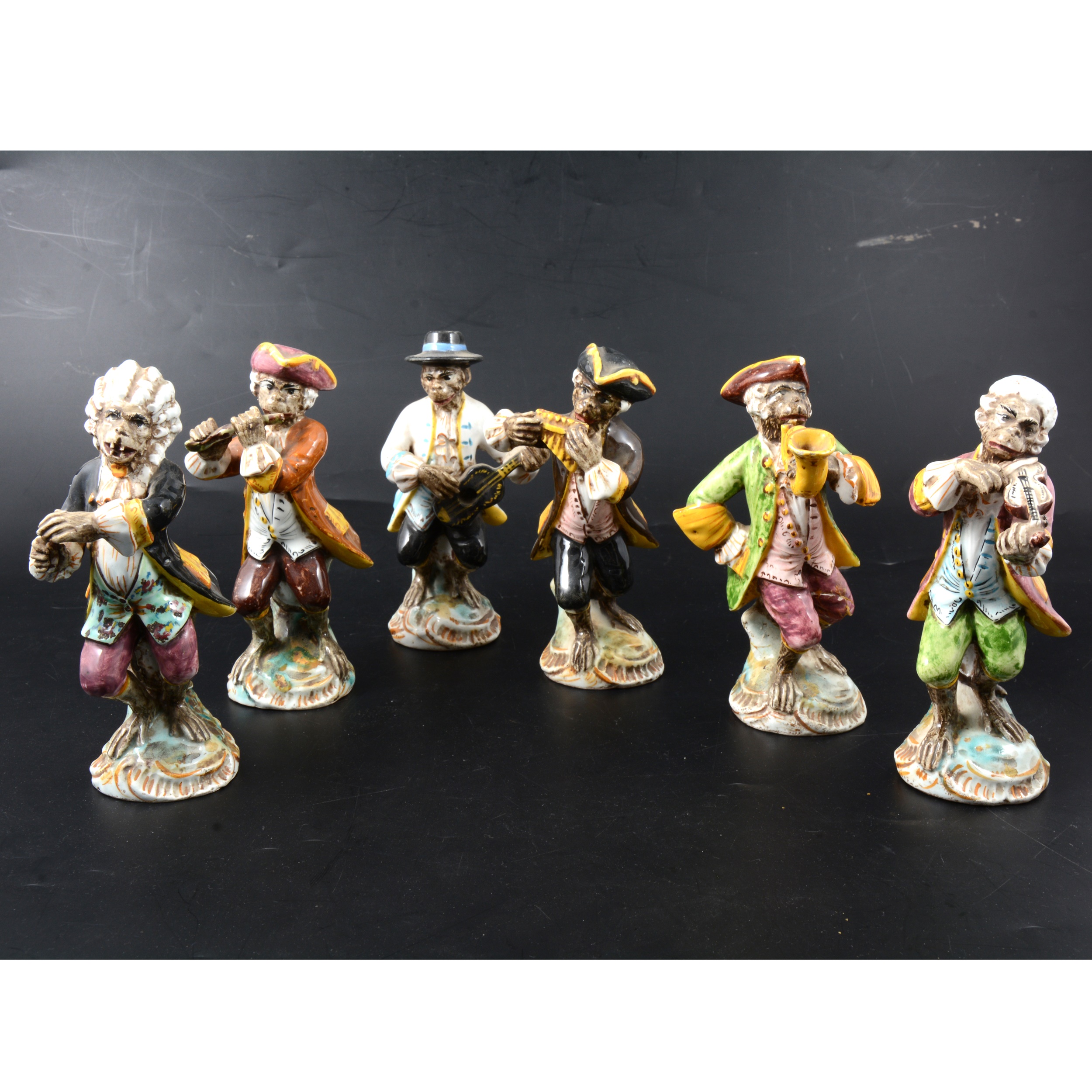 Set of six Italian majolica Monkey Band figures,