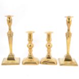 Two pairs of brass candlesticks,