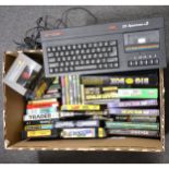 Sinclair ZX Spectrum +2 home computer, with a selection of cassette games