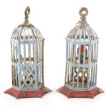 A pair of 20th century tin-plate penny toys, two bird cages