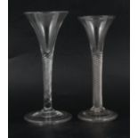 Two trumpet shaped wine glasses,