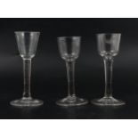 Two similar wine glasses, and another,