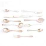 Silver and silver-plated spoons, fork, butter knives and small ladle.