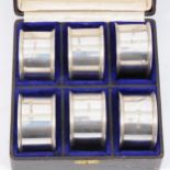 Cased set of six silver napkin rings by Barker Brothers, Chester 1913.