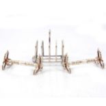 Silver toast rack and a pair of knife rests,