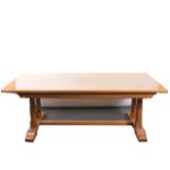 Light oak dining table; and two chairs,