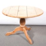 Pine pedestal kitchen table and three chairs,