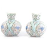 Pair of French opaque glass vases, decorated in the Persian taste.