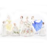 Seven Royal Doulton figures.