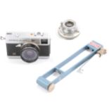 Olympus camera, Leitz Elmar lens, and a hygrometer.