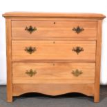 Stripped walnut chest of drawers and a pine headboard