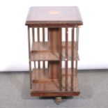 Edwardian mahogany and inlaid revolving bookcase.