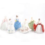 Six Royal Doulton figurines.