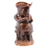 Staffordshire treacle-glazed Toby jug.